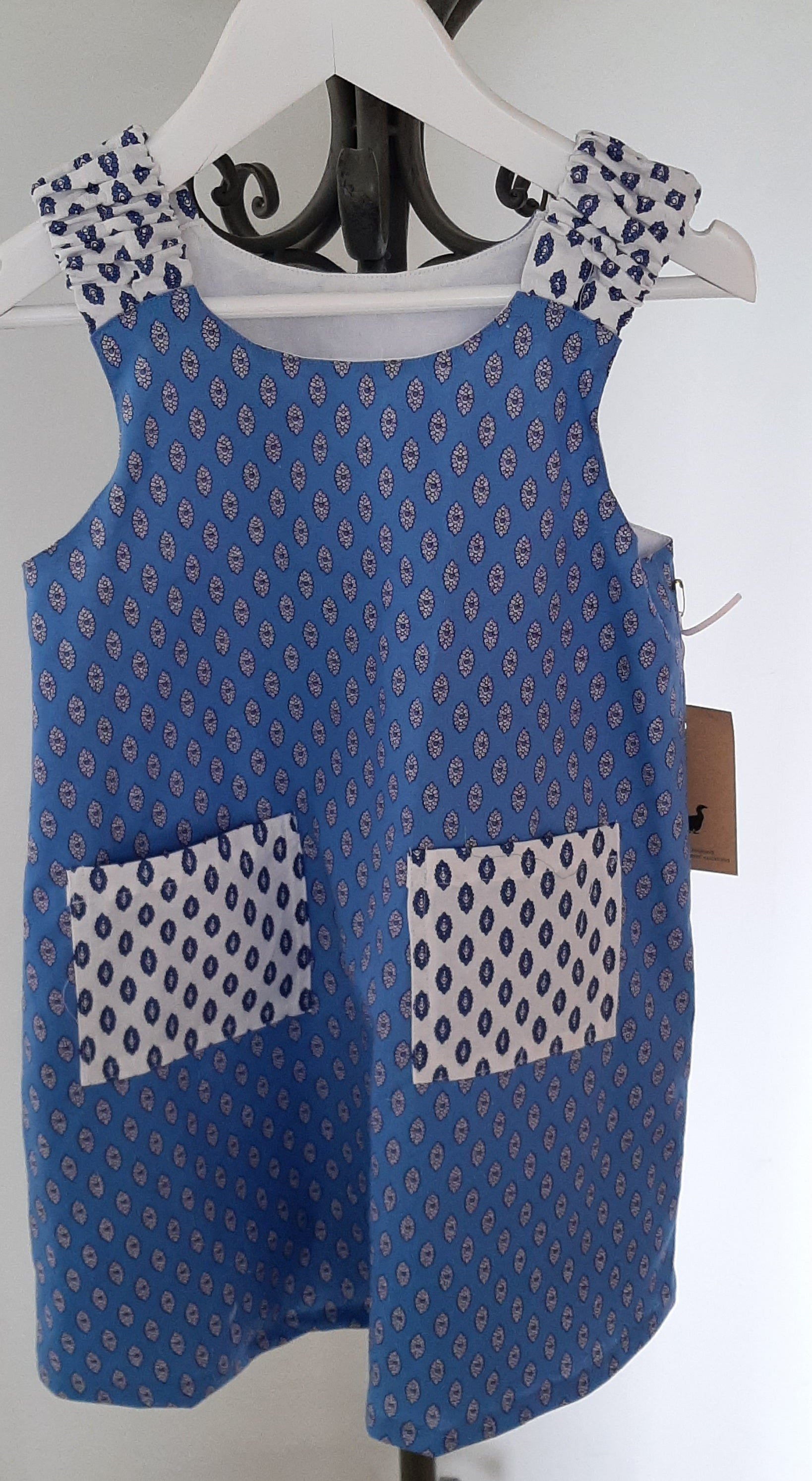 Blue Goose Claudette Pinafore - Blue Background